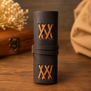 Leather journal rolled to show cross-laced spine